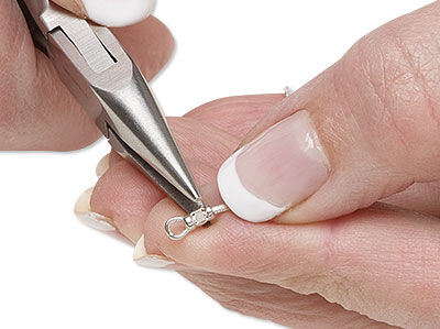 Pliers crimping the end of chain